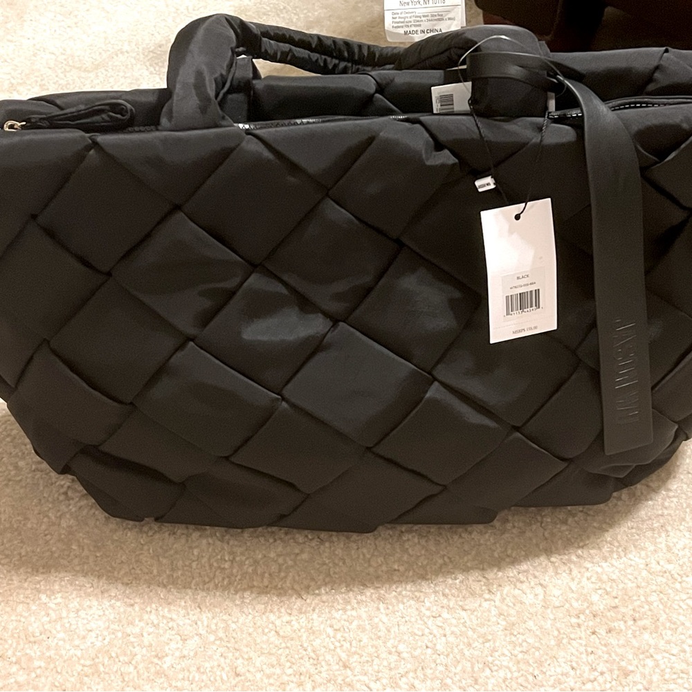 NWT black Jason Wu Dylan basket weave tote. Slight tear on handle shown in pics.